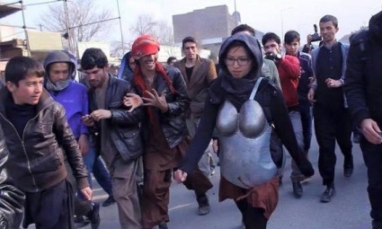  Kubra Khademi was surrounded by a mainly male crowd, which threw insults and stones during her walk. Photograph: Twitter